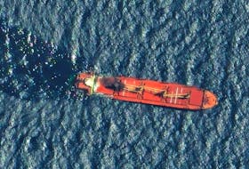 A satellite image shows the Belize-flagged and UK-owned cargo ship Rubymar, which was attacked by Yemen's Houthis, according to the U.S. military's Central Command, before it sank, on the Red Sea, March 1, 2024.  Maxar Technologies/Handout via