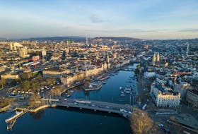 The Limmat river and the city are seen early morning in Zurich, Switzerland March 21, 2023.