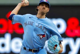Toronto Blue Jays starting pitcher Kevin Gausman throws to a Minnesota Twins batter during the first inning in Game 1 of an AL wild-card baseball playoff series Tuesday, Oct. 3, 2023, in Minneapolis. 