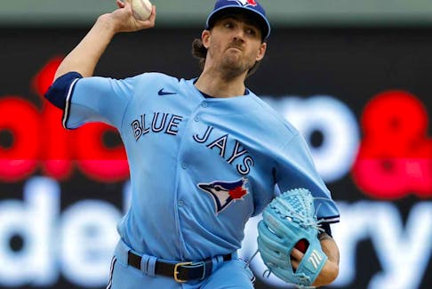 Toronto Blue Jays starting pitcher Kevin Gausman throws to a Minnesota Twins batter during the first inning in Game 1 of an AL wild-card baseball playoff series Tuesday, Oct. 3, 2023, in Minneapolis. 