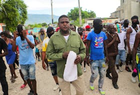 Former police officer Jimmy "Barbecue" Cherizier, leader of the 'G9' coalition, leads a march against Haiti's Prime Minister Ariel Henry, in Port-au-Prince, Haiti September 19, 2023.