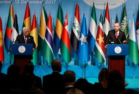 Turkish President Tayyip Erdogan and Palestinian President Mahmoud Abbas attend a news conference following the extraordinary meeting of the Organisation of Islamic Cooperation (OIC) in Istanbul, Turkey, December 13, 2017.
