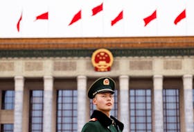 A paramilitary police officer stands guard, on the day of the opening session of the Chinese People's Political Consultative Conference (CPPCC), in front of the Great Hall of the People, in Beijing, China March 4, 2024.
