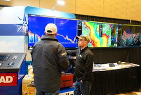 Colby Murphy with Atlantic Electronics Ltd. assisting a spectator with their queries during the P.E.I. Fishermen's Association Marine Trade Show, which took place on March 1 at Delta Hotel Prince Edward. Atlantic Electronics Ltd. sells various marine equipment, including charting systems, marine radars, autopilots, and depth sounders that are commonly used on boats. He said some fishers purchased these items during the event. Vivian Ulinwa/SaltWire