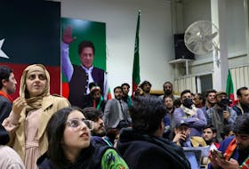 Volunteers for former Prime Minister Imran Khan's party Pakistan Tehreek-e-Insaf (PTI) look on as they watch results on TV screens in Islamabad, Pakistan, February 8, 2024.