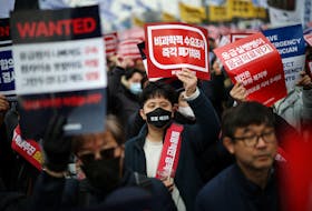 Doctors chant slogans during a rally to protest against government plans to increase medical school admissions in Seoul, South Korea, March 3, 2024.  