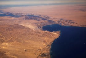 The Suez Canal connecting the Mediterranean Sea to the Red Sea is pictured from the window of a commercial plane flying over Egypt, December 18, 2019.