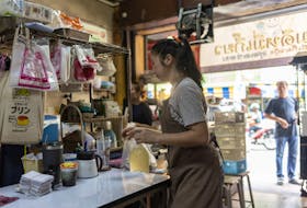 A woman works in a restaurant in Bangkok, Thailand September 11, 2023. Thailand's new government approved a raft of policies to lower the cost of living, suspend farmers' debts, draw more tourists and boost incomes.