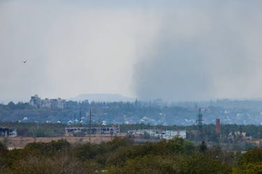 Smoke rises above the area of Avdiivka town in the course of Russia-Ukraine conflict, as seen from Yasynuvata (Yasinovataya) in the Donetsk region, Russian-controlled Ukraine, October 13, 2023.