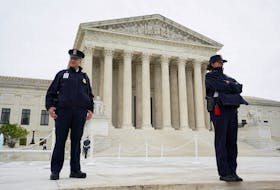 U.S. Supreme Court police officers stand on the front steps of the Supreme Court building prior to the official investiture ceremony for the court's newest Associate Justice Ketanji Brown Jackson and the start of the court's 2022-2023 term in Washington, U.S. September 30, 2022. 