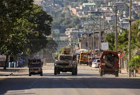 An armed vehicle is seen near the National Penitentiary following violent clashes in the capital that have damaged communications and led to a prison escape from this main penitentiary in Port-au-Prince, Haiti March 3, 2024.