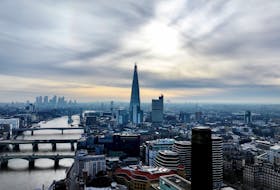 A drone view of London's Shard skyscraper with the Canary Wharf financial district in the background, two days before the government presents its critical pre-election budget, in London, Britain March 3, 2024.
