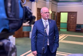 Newly-appointed Housing Minister Fred Hutton speaks with reporters outside the House of Assembly on Monday. -Juanita Mercer/SaltWire