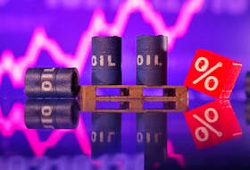 Miniatures of oil barrels and a rising stock graph are seen in this illustration taken January 15, 2024.