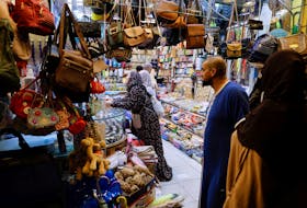 Muslims pilgrims shop in Mecca, Saudi Arabia, July 5, 2022.