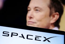 SpaceX logo and Elon Musk photo are seen in this illustration taken, December 19, 2022.