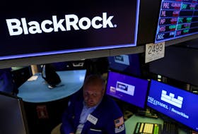 A specialist trader works at the post where BlackRock is traded on the floor of the New York Stock Exchange (NYSE) in New York City, U.S., July 21, 2022. 