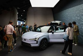 People look on during the reveal event of the Volvo EX30 electric SUV vehicle in Milan, Italy June 7, 2023.