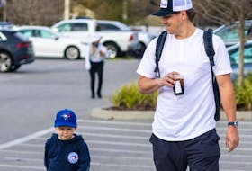 Blue Jays reliever Erik Swanson with son Toby in an image posted to his Instagram on Feb. 13, 2024.