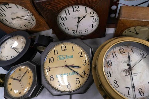 Vintage clocks are displayed at Electric Time Company in Medfield, Mass. Most of North America springs forward Sunday, March 10, for daylight saving time.