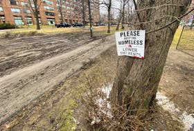 Scraped earth and a sign is all that remains in Victoria Park after the lone hold out in the former designated encampment, left,  Friday, March 8, 2024

TIM KROCHAK PHOTO