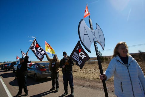 Demonstrators prtresting the newly implemented carbon tax, gather to axe the tax, om either side of the NB/NS border near Amherst Monday April 1, 2024.

TIM KROCHAK PHOTO