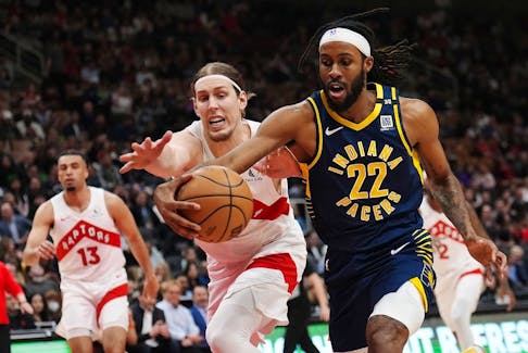 Indiana Pacers forward Isaiah Jackson and Toronto Raptors forward Kelly Olynyk battle for the ball during first half NBA basketball action in Toronto on Tuesday night. Nathan Dennette/THE CANADIAN PRESS
