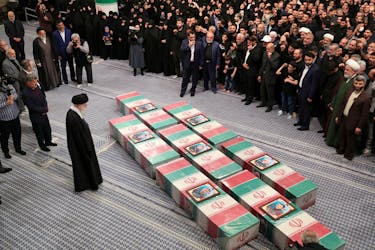Iran's Supreme Leader, Ayatollah Ali Khamenei looks at the coffins of members of the Islamic Revolutionary Guard Corps who were killed in the Israeli airstrike on the Iranian embassy complex in the Syrian capital Damascus, during a funeral ceremony in Tehran, Iran April 4, 2024. Office of the Iranian Supreme Leader/WANA (West Asia News Agency)/Handout via