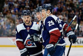 Colorado Avalanche linemates Nathan MacKinnon, right, and Jonathan Drouin, left, celebrate a goal against the Minnesota Wild at Ball Arena in Denver on Tuesday. - Isaiah J. Downing-USA TODAY Sports