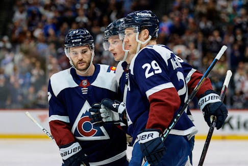 Colorado Avalanche linemates Nathan MacKinnon, right, and Jonathan Drouin, left, celebrate a goal against the Minnesota Wild at Ball Arena in Denver on Tuesday. - Isaiah J. Downing-USA TODAY Sports