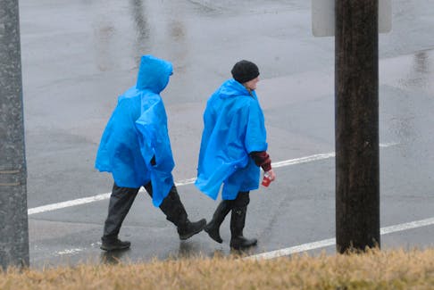 It was a wet day in the capital city on Thursday, April 20, 2023, especially for pedestrians out for a stroll, contending with the rain, drizzle and fog. The inclement weather though didn’t fizz on this duo as they were walking eastward on Empire Avenue near Stamp’s, one with Tim Hortons’s coffee cup in hand. Their water protection pull-over ponchos perhaps kept them a little dry enroute to their destination. -Joe Gibbons/The Telegram