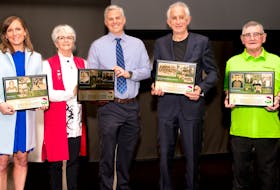 The P.E.I. Sports Hall of Fame recently inducted three individuals and one team at Credit Union Place in Summerside. From left are Katie Baker (field hockey), Valerie Moore and Gavin Moore, wife and son of the late Ray Moore (rugby), Al MacAdam, representing the 1969-70 Charlottetown Junior Islanders, and Rickey Burns (bowling). Phil Matusiewicz • Special to The Guardian