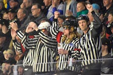 The four men known as “The Unofficials” cheer during Game 2 of the Cape Breton Eagles Quebec Maritimes Junior Hockey League playoff series against the Rimouski Océanic at Centre 200 in Sydney last month. The group, featuring Lee Crawley, Wes Stanford, Jason McPhee and Brandon Fraser, will be back at the rink for the start of Round 2 against Chicoutimi this weekend. JEREMY FRASER/CAPE BRETON POST