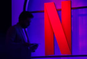 File photo: A man stands next to a logo of Netflix during an event in Mumbai, India, February 29, 2024.