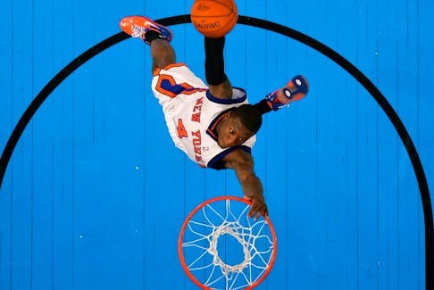 Nate Robinson of the New York Knicks attempts a dunk in the Slam Dunk Competition in 2007.
