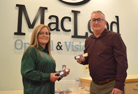 MacLeod Optical and Vision Centre owner Robert MacLeod, right, and optician Glenna Locke hold some pairs of eclipse glasses that have already been dropped off at the Grand Lake Road business following Monday’s total solar eclipse. MacLeod said they are hoping to collect 2,000 gently used pairs of eclipse glasses by April 30 and send them to South America so people in Chile and Argentina can safely view the annular solar eclipse on Oct. 2. Unlike a total eclipse, an annular eclipse takes place when the moon is slightly farther away from the Earth, allowing a ring of sunlight to remain around the moon even when the two disks align. Chris Connors/Cape Breton Post