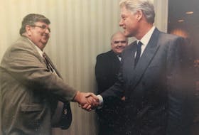Greg O'Keefe, left, shakes then U.S. President Bill Clinton's hand during the G7 Summit held in Halifax in 1995. CONTRIBUTED/NOVA SCOTIA TEACHERS UNION