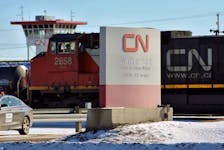 A locomotive moves through the Canadian National (CN) railyards in Edmonton February 22, 2015.