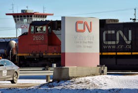 A locomotive moves through the Canadian National (CN) railyards in Edmonton February 22, 2015.
