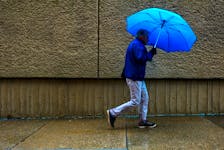 FOR NEWS STANDALONE:
A man with a colorful umbrella makes his way down the street, on a dreary wet afternoon in Halifax Thursday June 5, 2018. 

Tim Krochak/ The Chronicle Herald