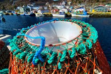 Pots paused  
   Crab pots and fishing vessels sit idle in Petty Harbour on a sunny but cool Friday afternoon. See story on page A4. Keith Gosse • The Telegram