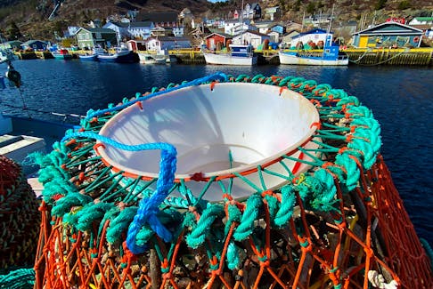Pots paused  
   Crab pots and fishing vessels sit idle in Petty Harbour on a sunny but cool Friday afternoon. See story on page A4. Keith Gosse • The Telegram