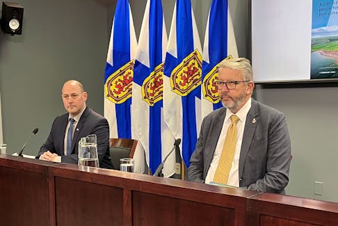 Environment Minister Tim Halman, left, and Municipal Affairs and Housing Minister John Lohr introduce the provincial government's plan for climate-resilient coastal communities at One Government Place in Halifax on Monday, Feb. 26, 2024.