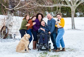 Nick MacPhail, in wheelchair, his mother Helen, on his left, father Colin on his right and siblings Leah, far left, Emma and Olive, far right. Colin MacPhail wants to help families of people who have cerebral palsy. He wants to share his experience so other's don't have to deal with similar problems he faced while raising his son Nick. Contributed