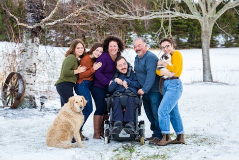 Nick MacPhail, in wheelchair, his mother Helen, on his left, father Colin on his right and siblings Leah, far left, Emma and Olive, far right. Colin MacPhail wants to help families of people who have cerebral palsy. He wants to share his experience so other's don't have to deal with similar problems he faced while raising his son Nick. Contributed