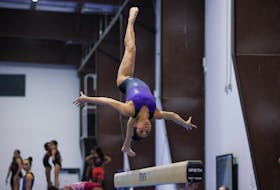 Sunisa Lee runs through her beam routine during the second day of a two-day media event with the USA Gymnastics team ahead of the 2024 Olympics in Katy, Texas, U.S. February 5, 2024. 