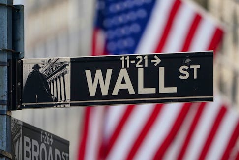 The Wall Street sign is pictured at the New York Stock exchange (NYSE) in the Manhattan borough of New York City, New York, U.S., March 9, 2020.