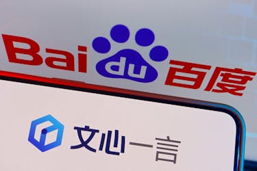 The logo of Baidu's AI chatbot Ernie Bot is displayed near a screen showing the Baidu logo, in this illustration picture taken June 28, 2023.