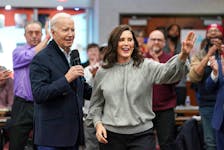 U.S. President Joe Biden speaks next to Michigan Governor Gretchen Whitmer, as he meets with autoworkers after the United Auto Workers (UAW) union recently endorsed Biden's reelection bid, at the UAW Region 1 George Merrelli Technical Training Center in Warren, in the Detroit metro area, Michigan, U.S., February 1, 2024.