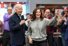 U.S. President Joe Biden speaks next to Michigan Governor Gretchen Whitmer, as he meets with autoworkers after the United Auto Workers (UAW) union recently endorsed Biden's reelection bid, at the UAW Region 1 George Merrelli Technical Training Center in Warren, in the Detroit metro area, Michigan, U.S., February 1, 2024.